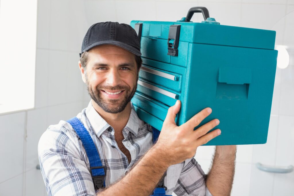 man carrying a tool box